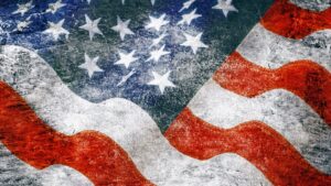 USA, American flag painted on textile. Background in grunge colored style obtained by double exposure technique.